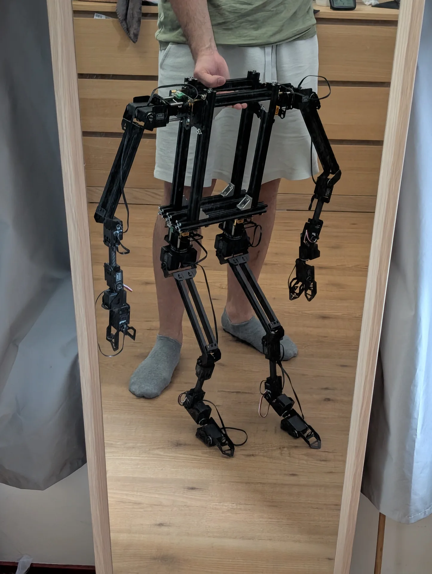 Gibbon Bot mk.2 assembled robot held for scale next to a person